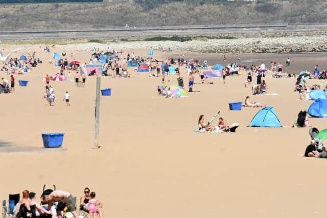 Families flocked to the beach as temperatures soared.
