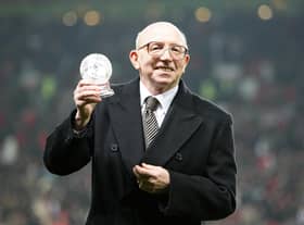 1966 World Cup winner Nobby Stiles is presented with an award on the pitch prior to kick off.