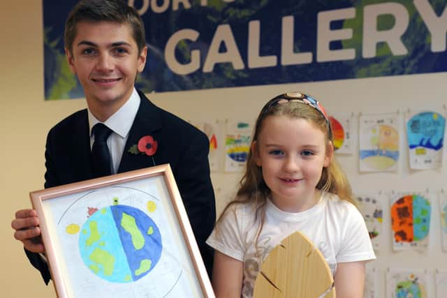 Faith Wardle receives her award from Cllr Adam Ellison.