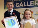 Faith Wardle receives her award from Cllr Adam Ellison.