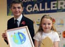 Faith Wardle receives her award from Cllr Adam Ellison.