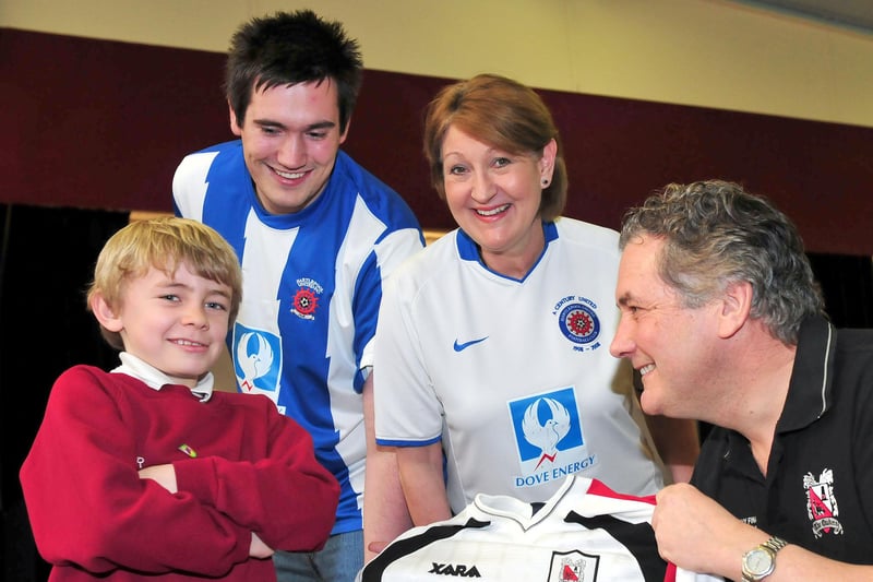 West View Primary School headteacher Andy Brown tempts pupil and Hartlepool United supporter Taylor Robinson into putting on a Darlington shirt, as teachers and fellow Hartlepool United supporters Jonathan Armstrong and Sue Horton look on. But who can tell us more about this 2012 event?