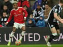 Manchester United's English striker Marcus Rashford (L) looks to play a pass during the English Premier League football match between Newcastle United and Manchester United at St James' Park in Newcastle-upon-Tyne, north east England on December 27, 2021.  (Photo by PAUL ELLIS/AFP via Getty Images)