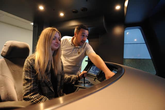 Nexus new Metro simulator for it new fleet of trains - Michael Darling at the controls with reporter Georgina Cutler.