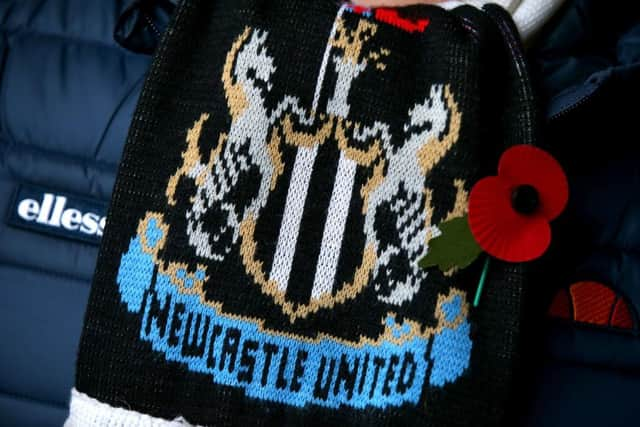 A Newcastle United scarf  (Photo by Alex Livesey/Getty Images)