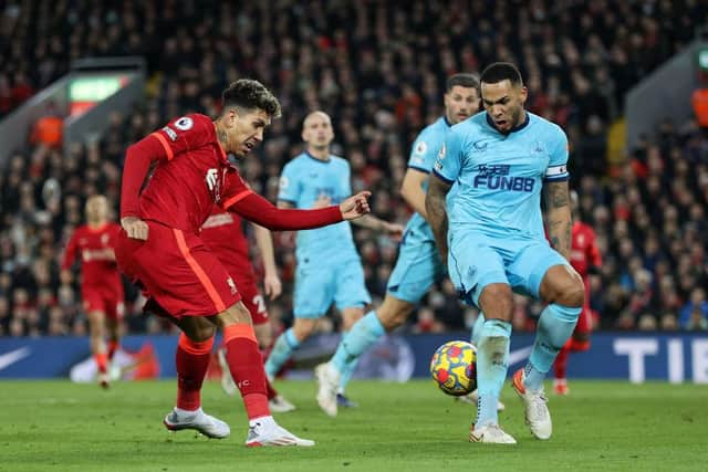 Roberto Firmino of Liverpool shoots during the Premier League match between Liverpool and Newcastle United at Anfield on December 16, 2021 in Liverpool, England. (Photo by Clive Brunskill/Getty Images)