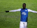 Mo Eisa of Peterborough United celebrates after scoring his second, Peterborough's third goal during the EFL Trophy match between Peterborough United and West Ham United.