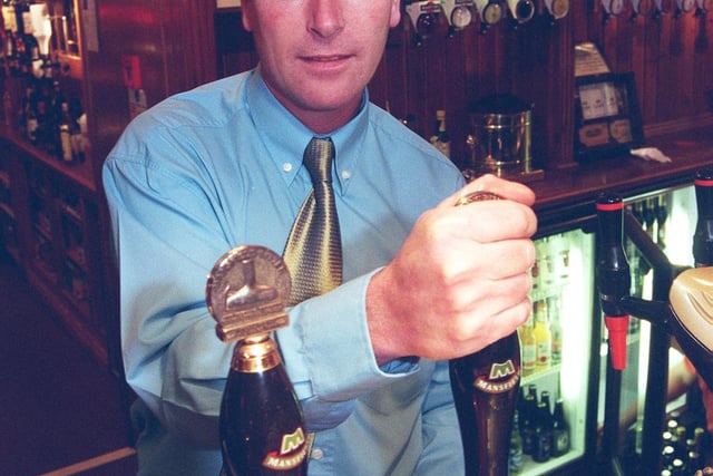 Pictured at the Friar Tuck Pub, Calow, Chesterfield in 2000 was Manager Pat Heard and ex football player, who now runs the pub, and is also a stage hypnotist.