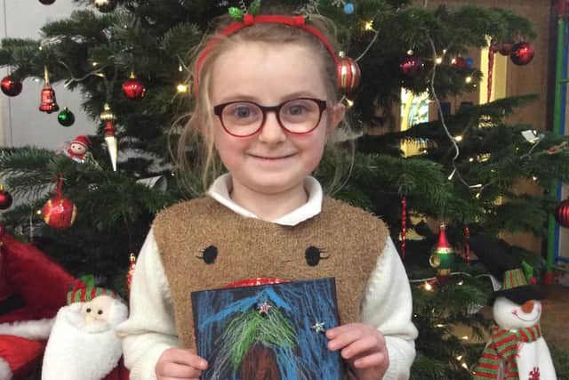 A Green Class pupil with her Christmas letter