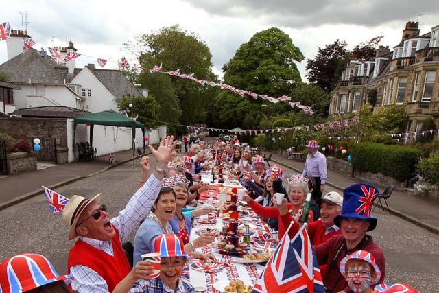 Residents of Murrayfield Drive in Edinburgh, sitting down to a Jubilee street party. 04/06/12