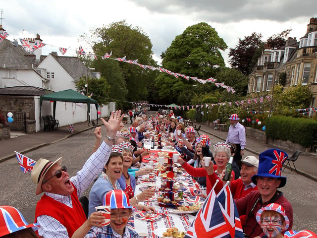 Residents of Murrayfield Drive in Edinburgh, sitting down to a Jubilee street party. 04/06/12