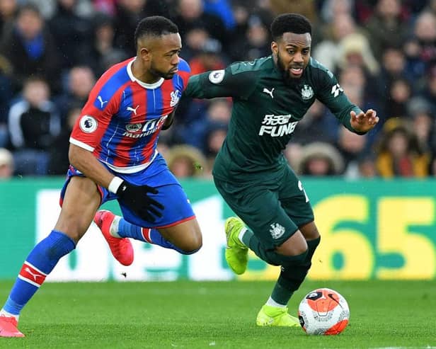 Crystal Palace's French-born Ghanaian striker Jordan Ayew (L) vies with Newcastle United's English defender Danny Rose during the English Premier League football match between Crystal Palace and Newcastle United at Selhurst Park in south London on February 22, 2020.