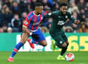 Crystal Palace's French-born Ghanaian striker Jordan Ayew (L) vies with Newcastle United's English defender Danny Rose during the English Premier League football match between Crystal Palace and Newcastle United at Selhurst Park in south London on February 22, 2020.