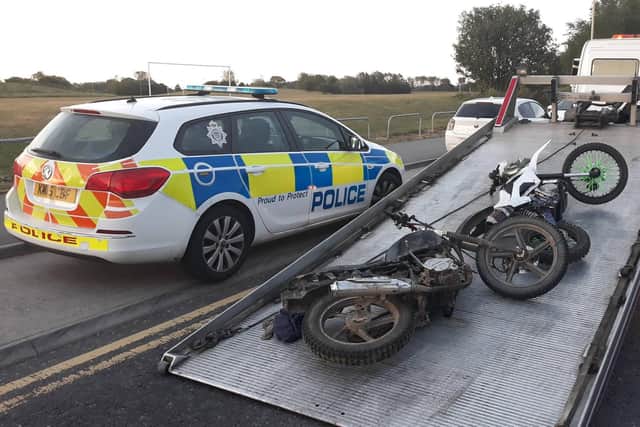 Northumbria Police with two of the recently seized bikes.