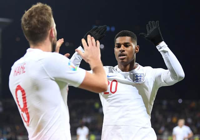 Harry Kane and Marcus Rashford playing for England.