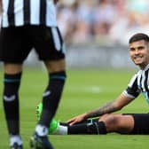 Newcastle United's Brazilian midfielder Bruno Guimaraes (R) reacts after being fouled during the English Premier League football match between Newcastle United and AFC Bournemouth at St James' Park in Newcastle-upon-Tyne, north east England on September 17, 2022. (Photo by LINDSEY PARNABY/AFP via Getty Images)