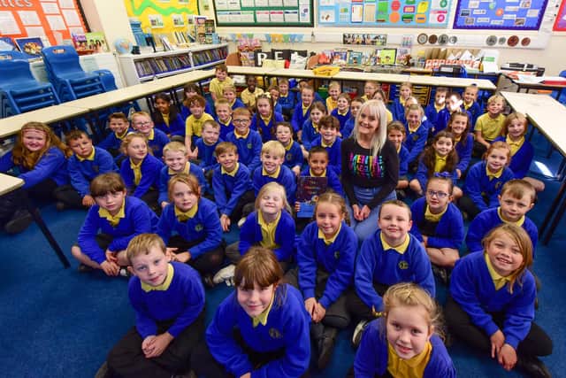 Author Lauren Davis reading her book about autism and mental health at Lord Blyton Primary School.