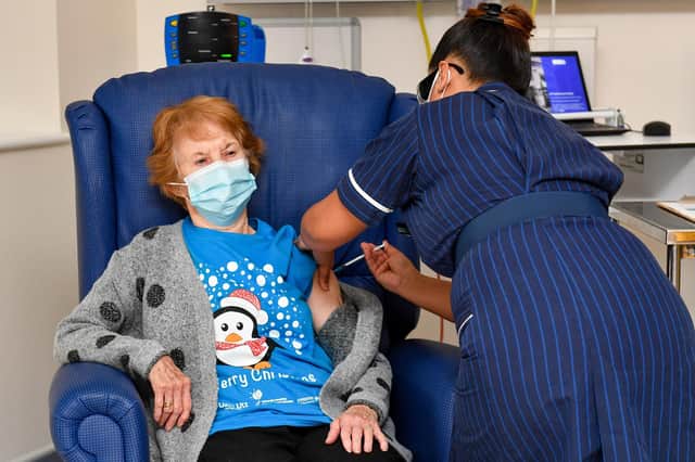 Margaret Keenan, 90, is the first patient in the United Kingdom to receive the Pfizer/BioNtech covid-19 vaccine at University Hospital, Coventry, administered by nurse May Parsons, at the start of the largest ever immunisation programme in the UK's history.