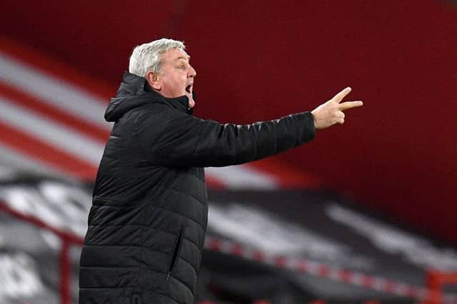 Newcastle United's English head coach Steve Bruce shouts instructions to his players from the touchline during the English Premier League football match between Sheffield United and Newcastle United at Bramall Lane in Sheffield, northern England on January 12, 2021.