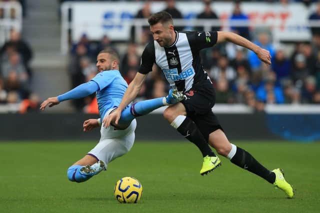 Manchester City's English defender Kyle Walker (L) vies with Newcastle United's Welsh defender Paul Dummett during the English Premier League football match between Newcastle United and Manchester City at St James' Park in Newcastle-upon-Tyne, north east England on November 30, 2019.