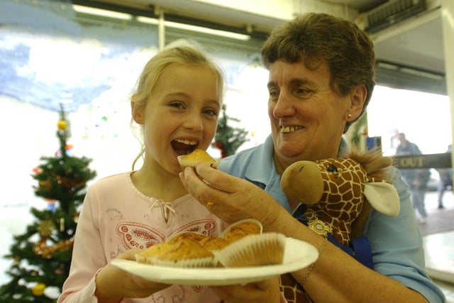 Grandmother Trish Octon gives granddaughter Hannah Kirsop a special treat to help raise money for the Shoebox Appeal in 2005.