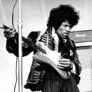 American singer and guitarist Jimi Hendrix performs on stage without the distraction of Netflix.