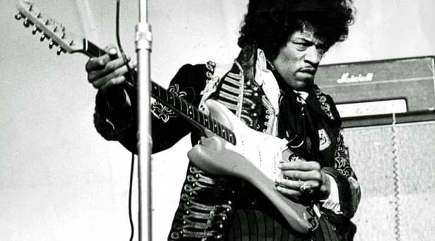 American singer and guitarist Jimi Hendrix performs on stage without the distraction of Netflix.