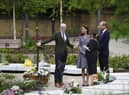 MANCHESTER, UNITED KINGDOM - MAY 10: The memorial designer Andy Thomson, left, the director of BCA Landscape and Joanne Roney, third left, the chief executive of Manchester City Council show Prince William, Duke of Cambridge and his wife Catherine, Duchess Of Cambridge around as they attend the launch of the Glade of Light Memorial garden, outside Manchester Cathedral on May 10, 2022 in Manchester, England.  The Glade of Light Memorial commemorates the victims of the terrorist attack that took place after an Ariana Grande concert at Manchester Arena on May 22, 2017.  (Photo by Jon Super-WPA Pool/Getty Images)