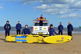 RNLI lifeguards training ready for the summer season with a stay safe summer of staycation message.