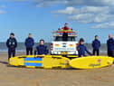 RNLI lifeguards training ready for the summer season with a stay safe summer of staycation message.