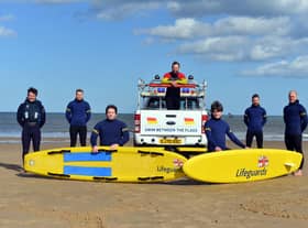 RNLI lifeguards training ready for the summer season with a stay safe summer of staycation message.