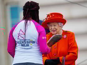 Kadeena Cox receiving the Baton from The Queen at the Queen's Baton Relay launch.