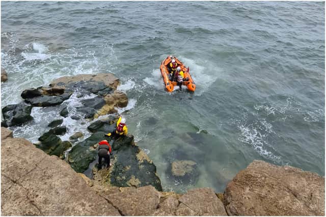The dramatic rescue operation saw the RNLI volunteer crew use a procedure known as 'veering' to safely reverse the boat towards the rocks. 
Photo by Sunderland Coastguard Rescue Team.