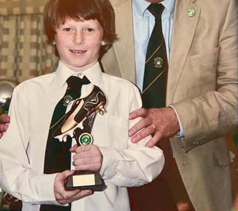 Elliot Anderson receives an award from Wallsend Boys Club chairman Steve Dale.