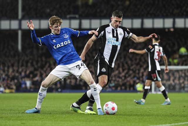 EvertonÕs Anthony Gordon (left) and Newcastle United's Fabian Schar (right) battle for the ball during the Premier League match at Goodison Park, Liverpool. Picture date: Thursday March 17, 2022.