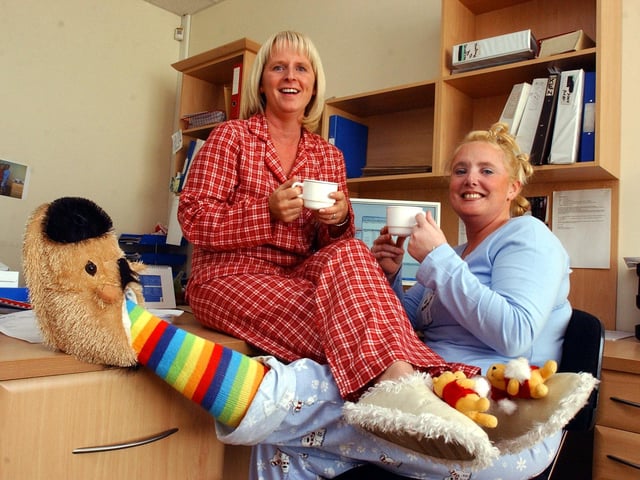 Customer care staff Elaine Peterson and Gemma Oman wore their pyjamas to work at Roundels Kitchens in Harton Lane for Children In Need in 2005.