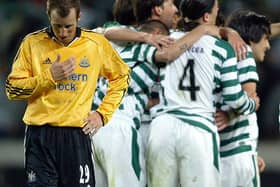 Sporting Lisbon's players celebrate their victory next Newcastle United's Lee Bowyer in April 2005.
