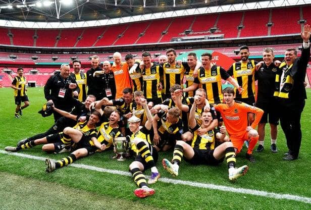 Hebburn Town players and staff celebrate with the Buildbase FA Vase 2019/20 Trophy after the Final at Wembley Stadium, London.
