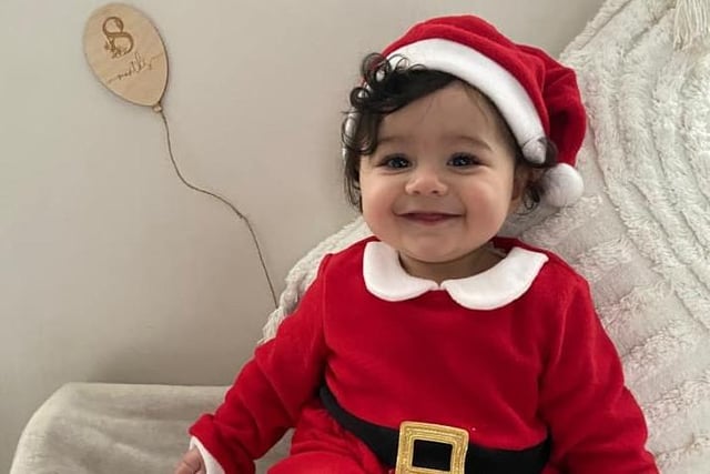 Zayah, age 8 months, ready to celebrate her first Christmas.