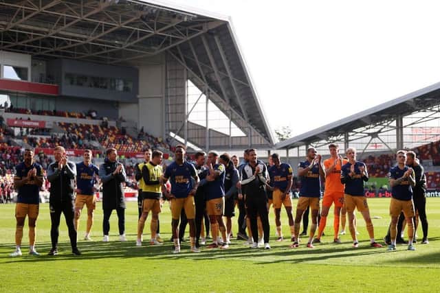 Newcastle United players applaud the fans after the team's victory in the Premier League match between Brentford FC and Newcastle United at Brentford Community Stadium on April 08, 2023 in Brentford, England. (Photo by Alex Pantling/Getty Images)