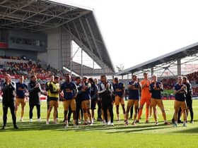 Newcastle United players applaud the fans after the team's victory in the Premier League match between Brentford FC and Newcastle United at Brentford Community Stadium on April 08, 2023 in Brentford, England. (Photo by Alex Pantling/Getty Images)
