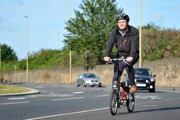 Cyclist Jonathan Barlow using the cycle lanes around The Arches, Tyne Dock.