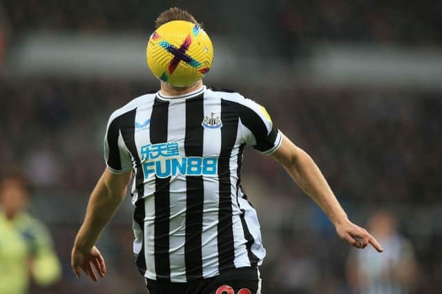 Newcastle United's New Zealand striker Chris Wood runs with the ball during the English Premier League football match between Newcastle United and Leeds United at St James' Park in Newcastle-upon-Tyne, north east England on December 31, 2022.(Photo by LINDSEY PARNABY/AFP via Getty Images)