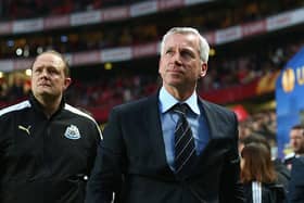 Then-Newcastle United manager Alan Pardew, flanked by goalkeeping coach Andy Woodman, at the Estadio da Luz in April 2013.
