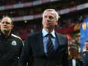 Then-Newcastle United manager Alan Pardew, flanked by goalkeeping coach Andy Woodman, at the Estadio da Luz in April 2013.