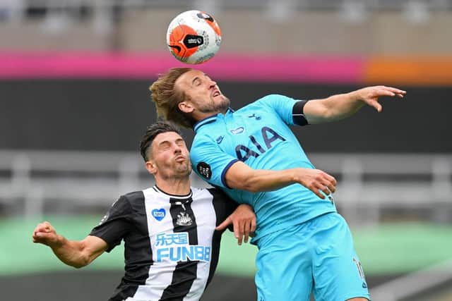 Fabian Schar challenges Harry Kane.