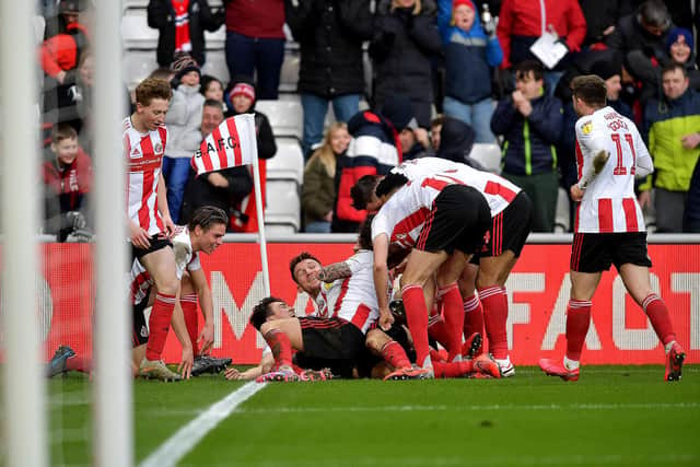Sunderland players celebrate scoring against Bristol Rovers.