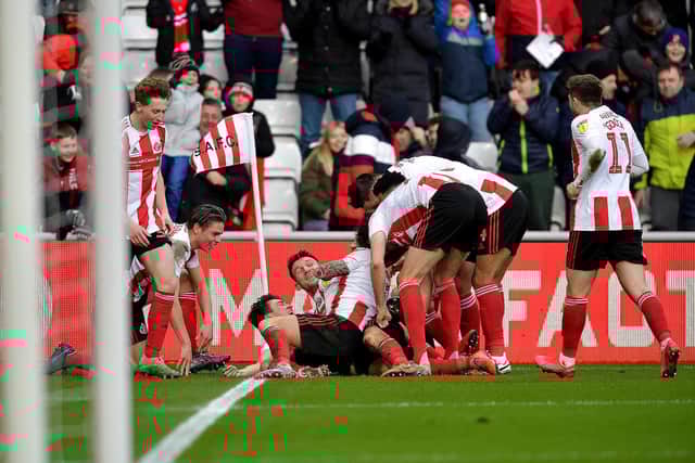 Sunderland players celebrate scoring against Bristol Rovers.
