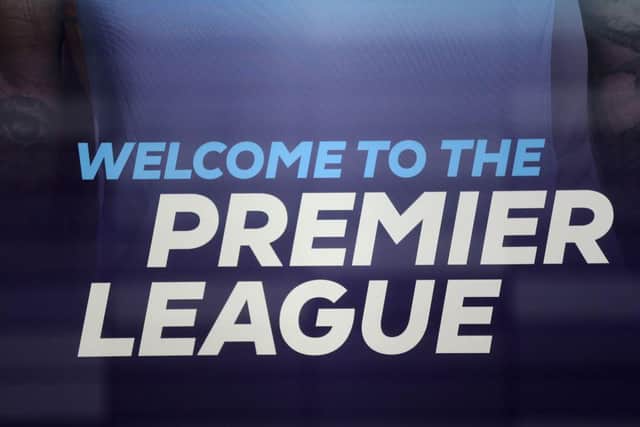 The logo is pictured through a glass window at the headquarters of the Premier League.