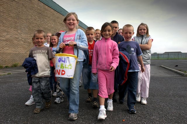 Youngsters from the Red Roof Kids Club were on a sponsored walk to raise money for a new mini bus in 2004.